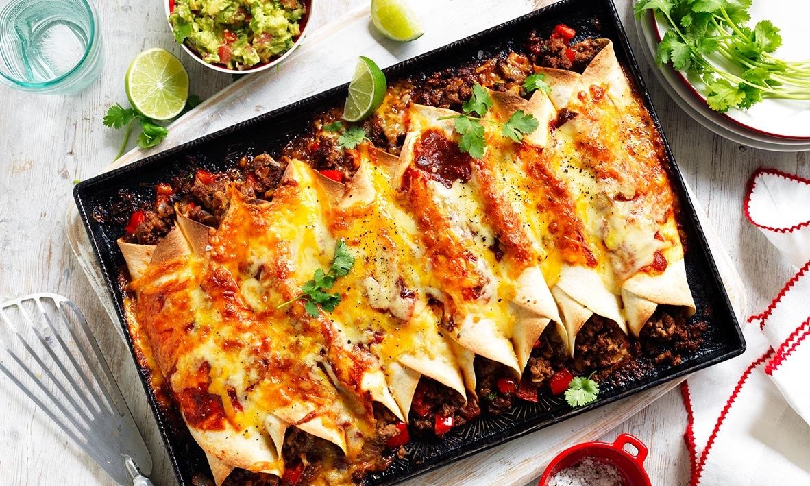 Cheesy chicken enchiladas with red sauce